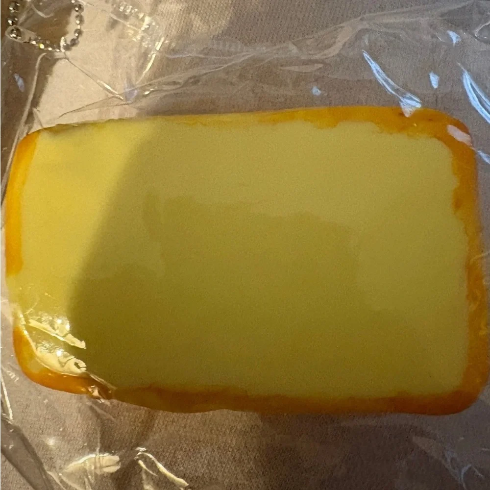 Taba squishy looks like a mini pound cake with the image of hello kitty fidget t